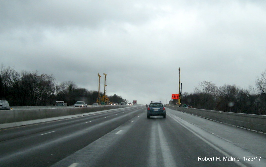 Image of crane structures on both sides of I-95 in Add-A-Lane workzone in Needham