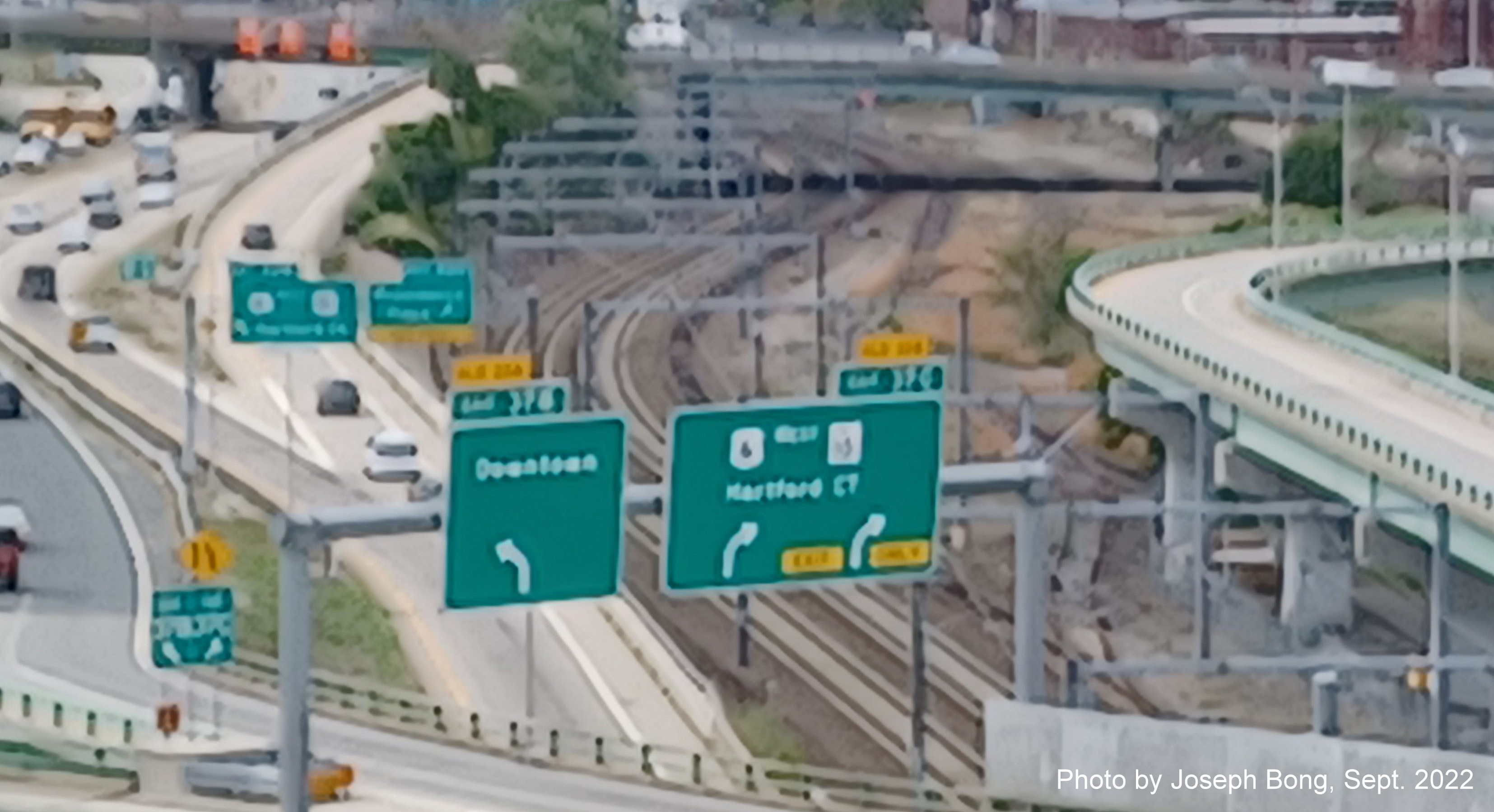 Image of overhead signs for Downtown and US 6 West/RI 10 exits with new milepost based exit numbers,
by Joseph Bong, September 2022