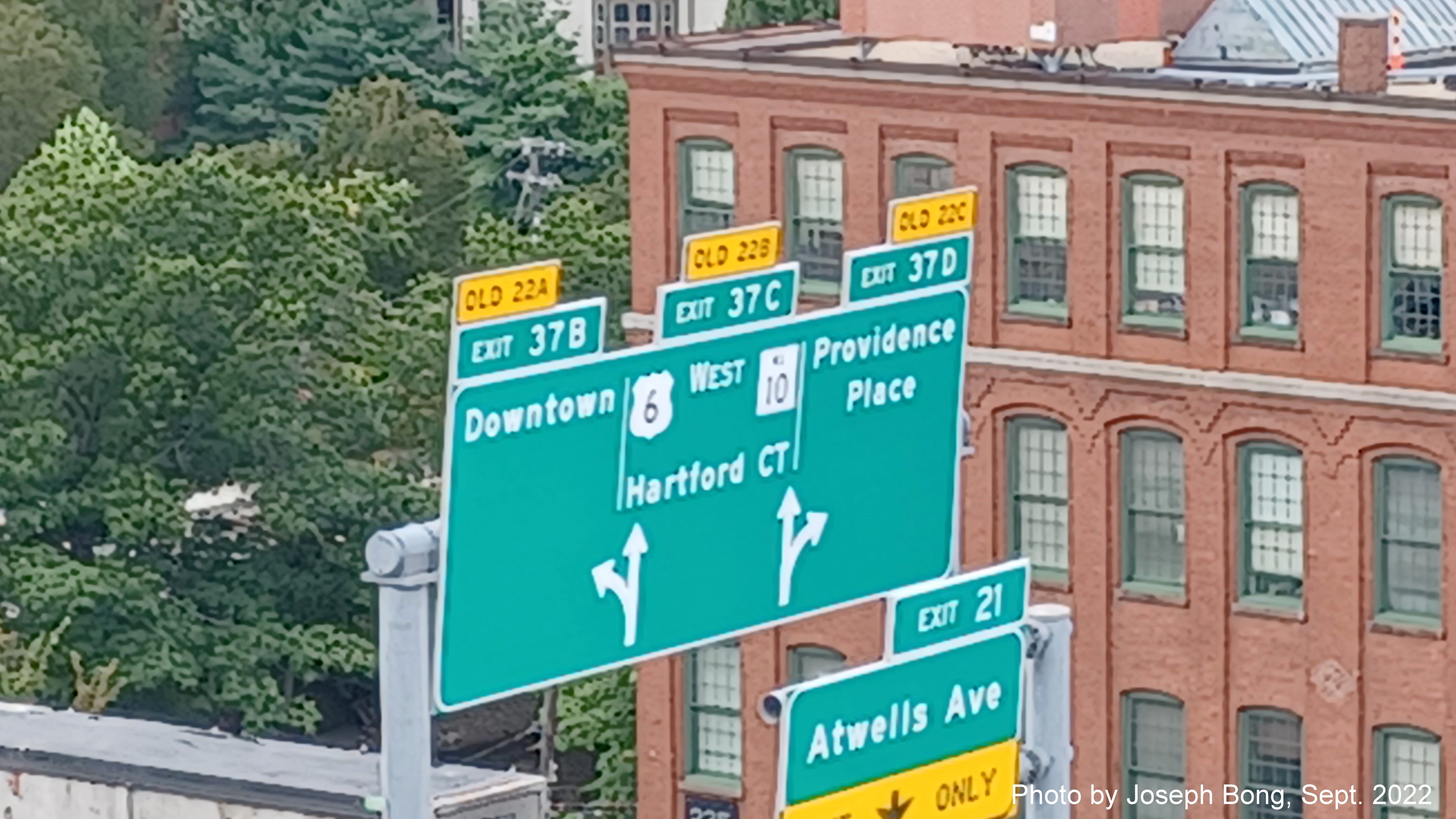 Image of overhead signs for Downtown, US 6 West/RI 10 and Providence Place exits with new milepost based exit numbers,
                                         by Joseph Bong, September 2022