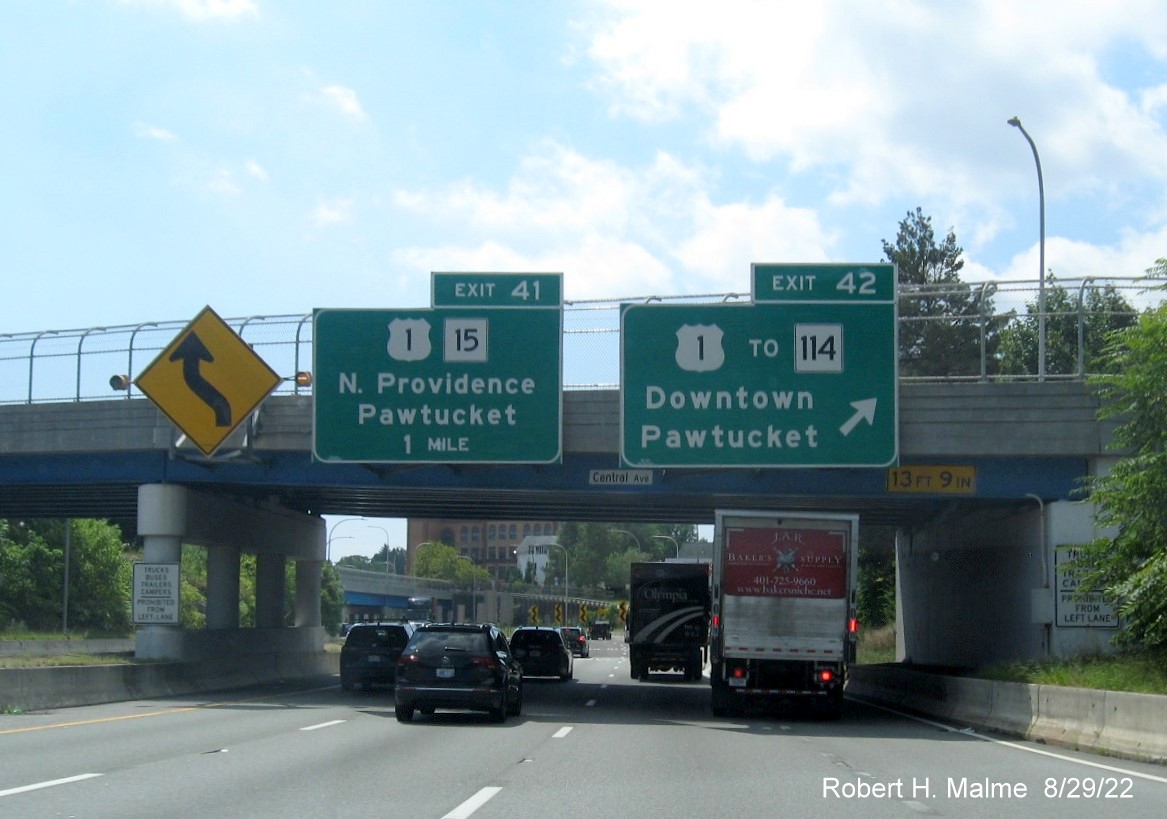 Image of overhead signsge for US 1/RI 15 and US 1 to RI 114 exits with new milepost based exit number 
        on I-95 South in Pawtucket, August 2022