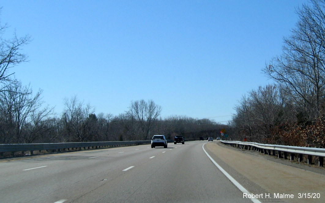 Image of orange contractor tag for future placement of new 1-mile advance sign for MA 1A exits on I-95 South in Attleboro