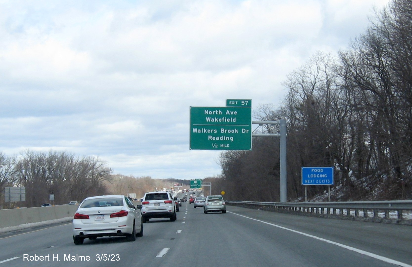 Image of recently placed 1 mile advance overhead sign for North Avenue/Walkers Brook Drive exit on
                                     I-95/MA 128 North in Reading, March 2023