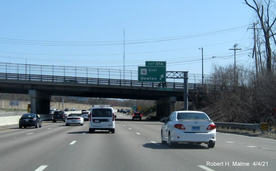 Image of overhead ramp sign for MA 16 East exit with new milepost based exit number on I-95/MA 128 South in Newton, April 2021
