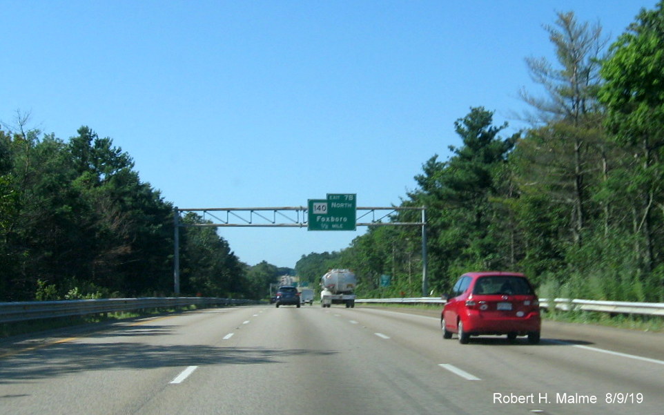 Image of two orange contractor tags marking site of future overhead signs for MA 140 exits on I-95 South in Foxboro