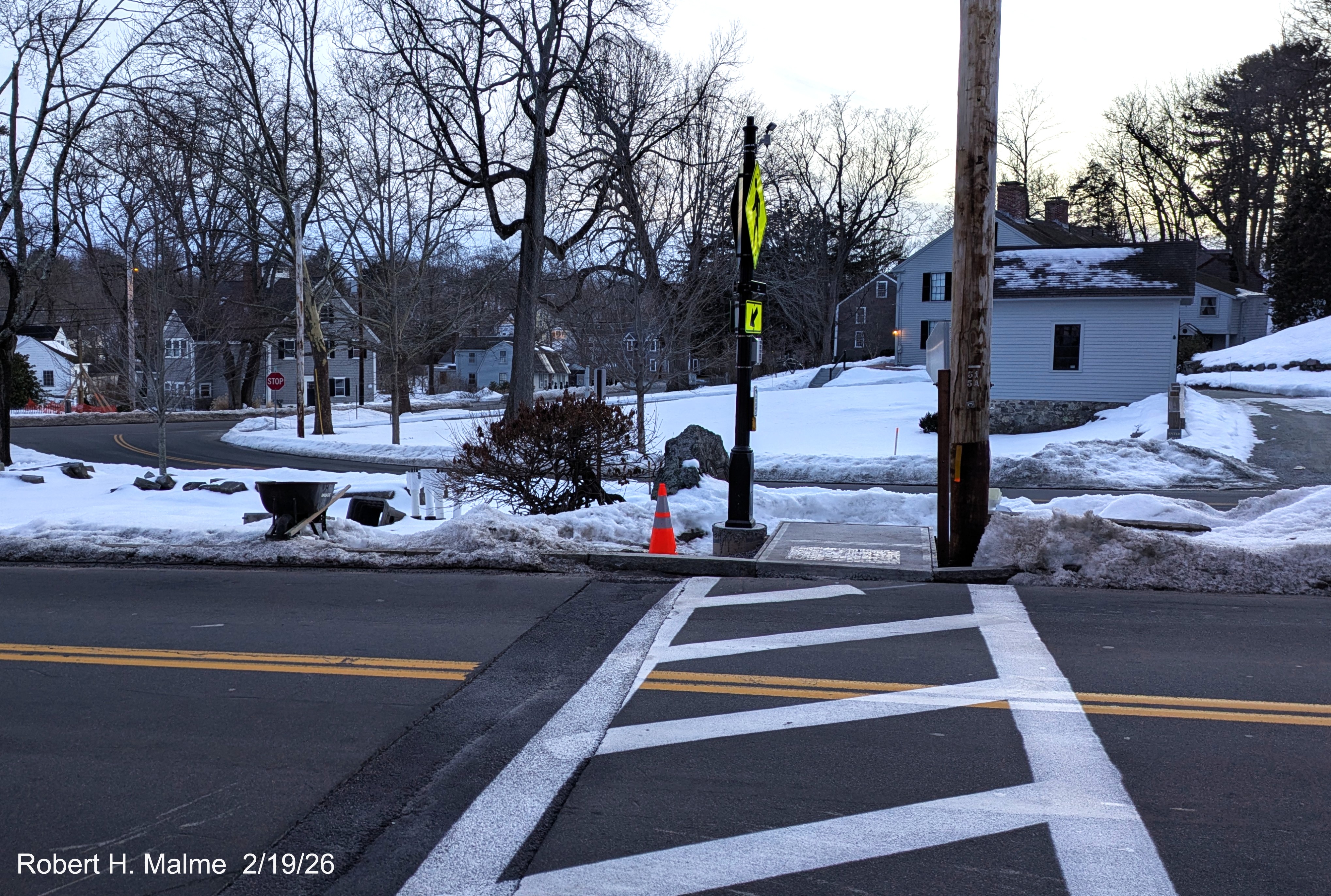Image of new pedestrian crosswalk now with lines painted across Lincoln Street looking 
	across the street toward the Benjamin Lincoln House, February 2026