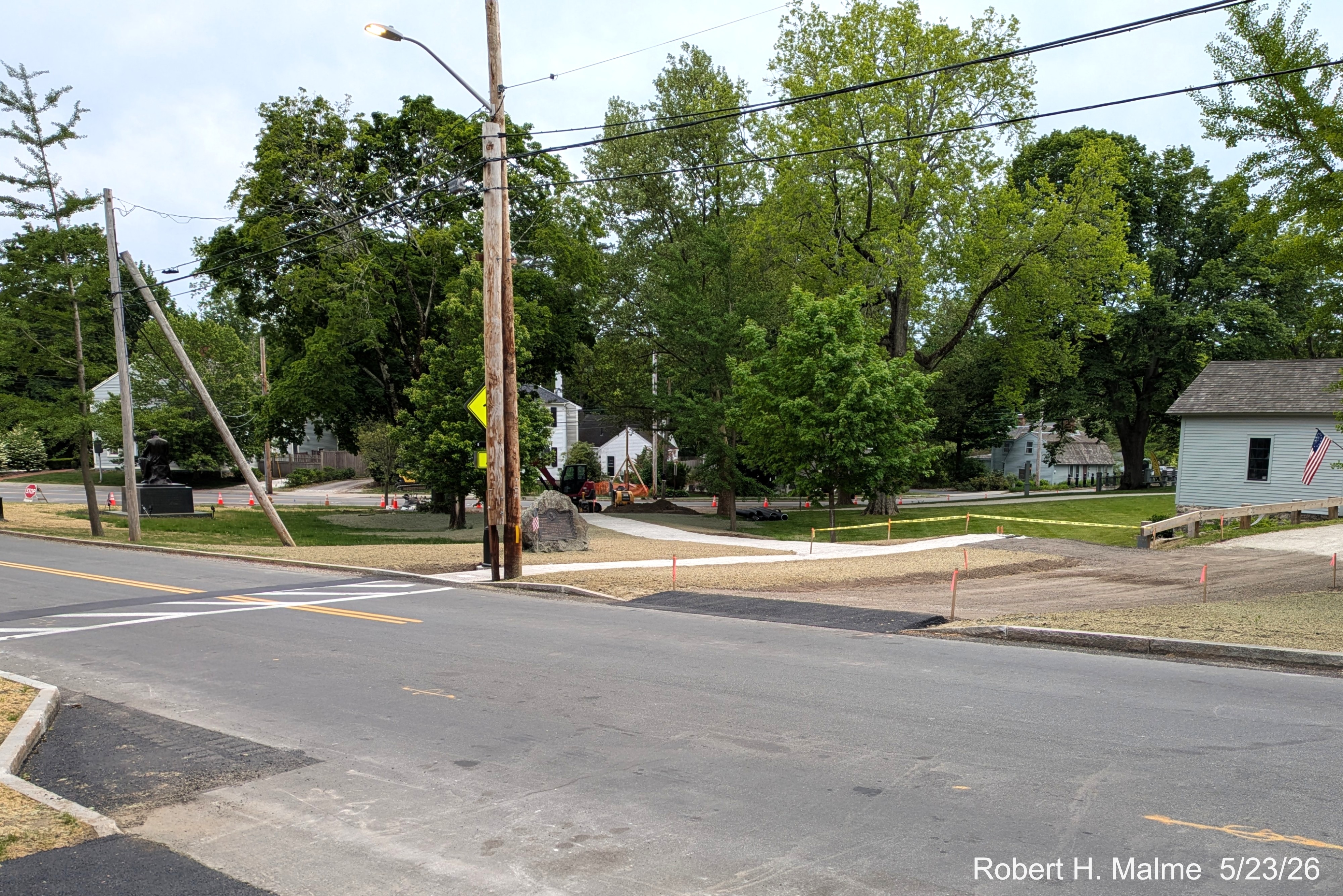 Image looking across Lincoln Street showing the nearly completed walkway beyond the
	Benjamin Lincoln House driveway, May 2026