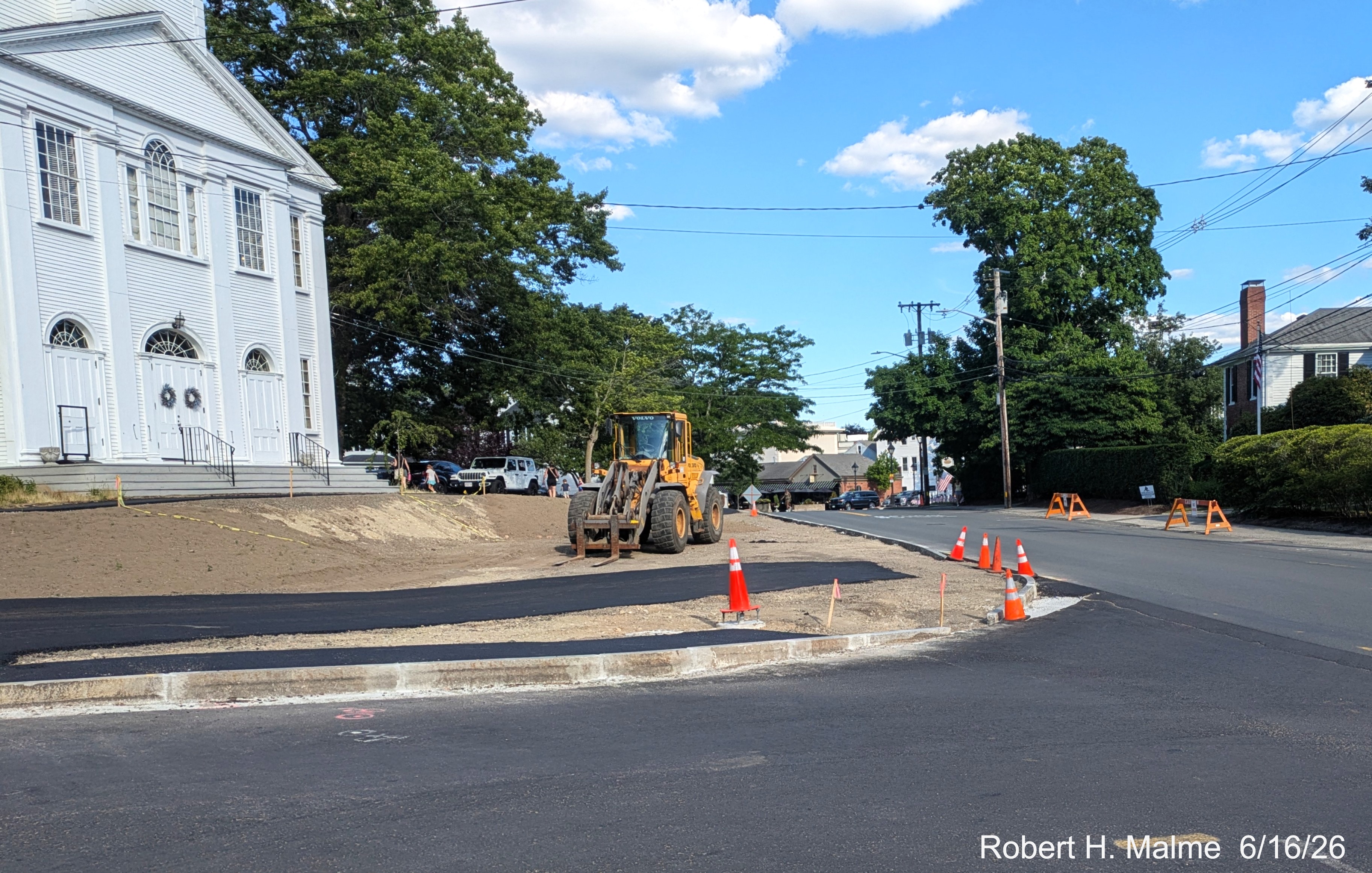 Image taken at corner of Lincoln and North Streets, showing the completion on curbing 
	work and landscaping in front of the New North Church, June 2026
