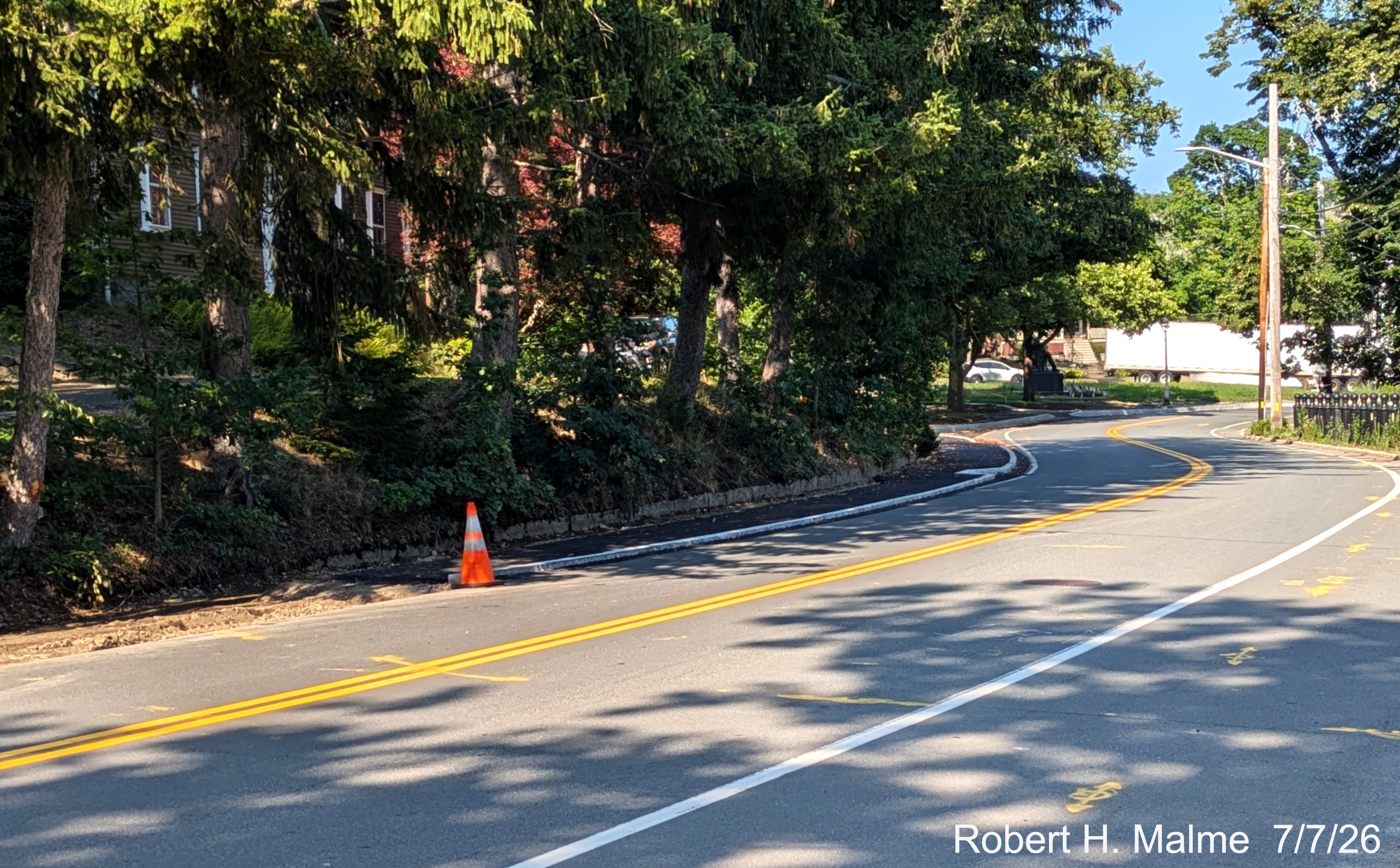 Image taken looking east at the end of sidewalk construction along the north side of
	North Street, July 2026