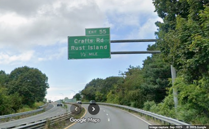 Image of new 1/2 Mile advance overhead sign for Crafts Road exit on MA 128 South in 
	Gloucester, Google Maps Street View, September 2025