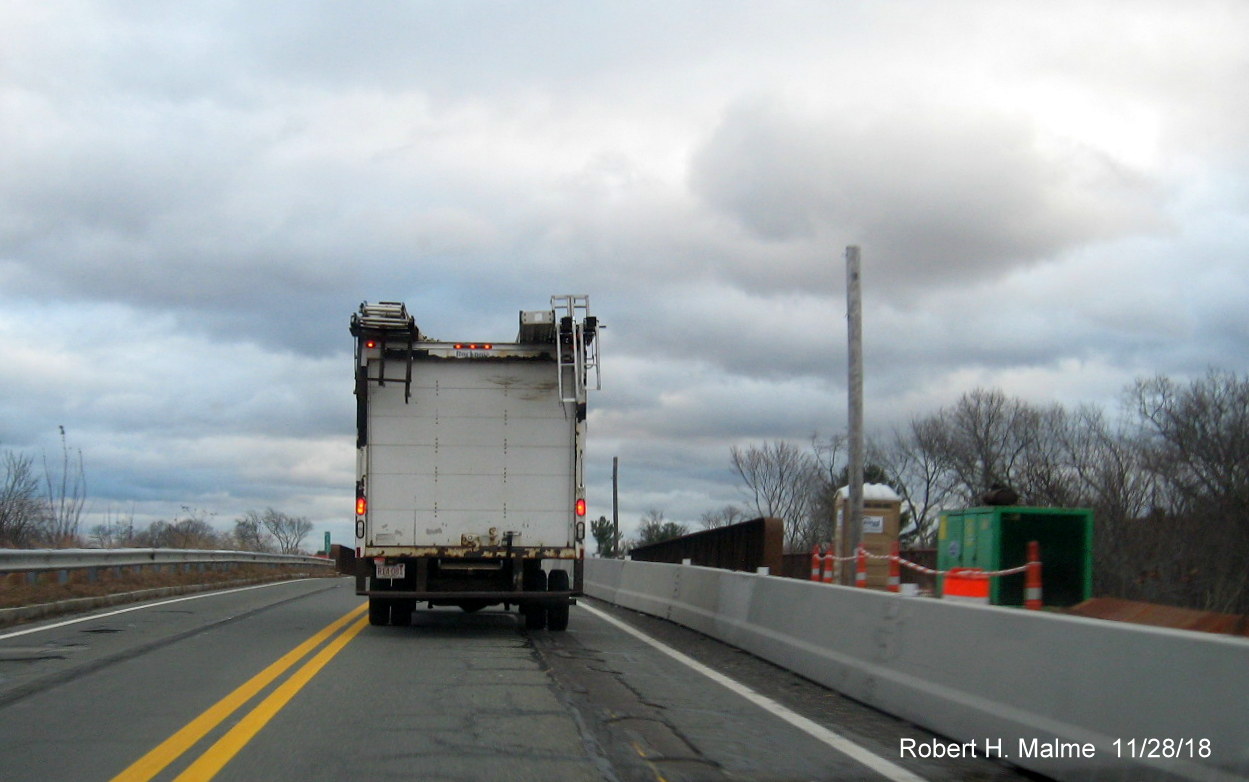 Image of concrete barrier separating MA 18 traffic from bridge construction in widening project work zone in Weymouth