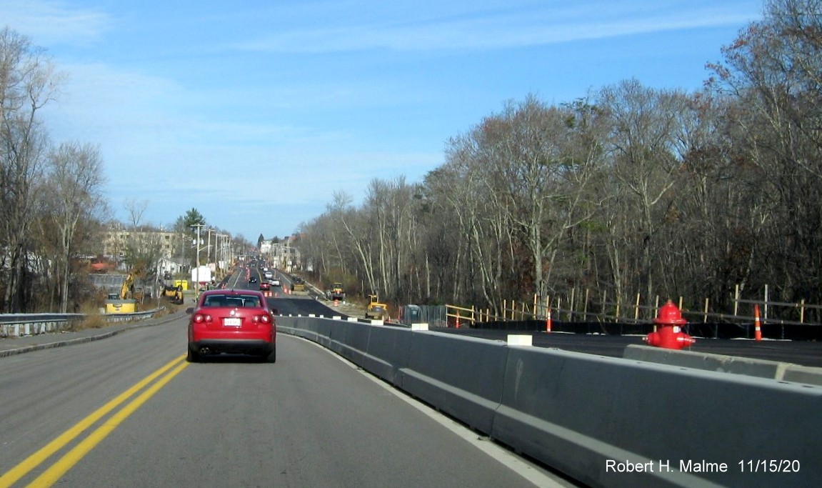 Image of view from top of commuter railroad bridge looking north on MA 18 toward widened roadway lanes in South Weymouth, November 2020