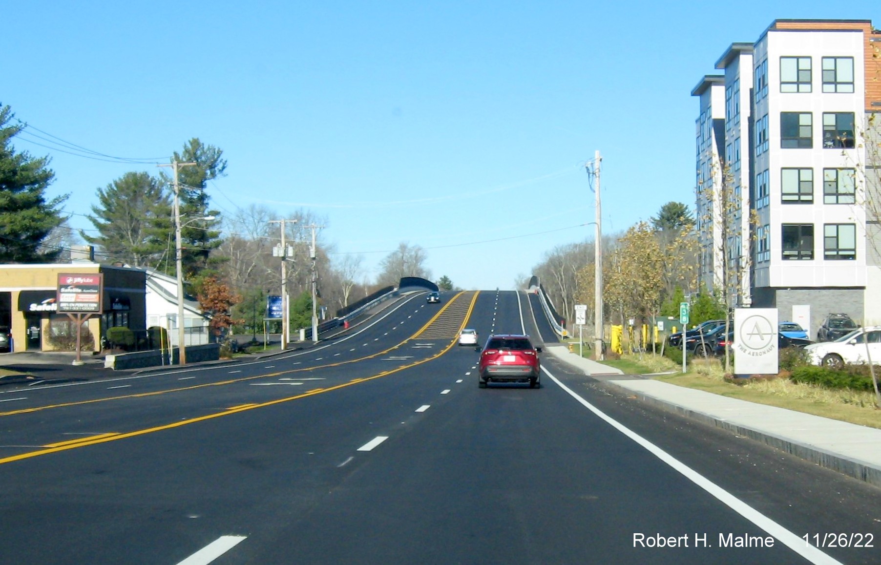 Image of MA 18 traffic approaching completed commuter railroad bridge in South Weymouth, November 2022