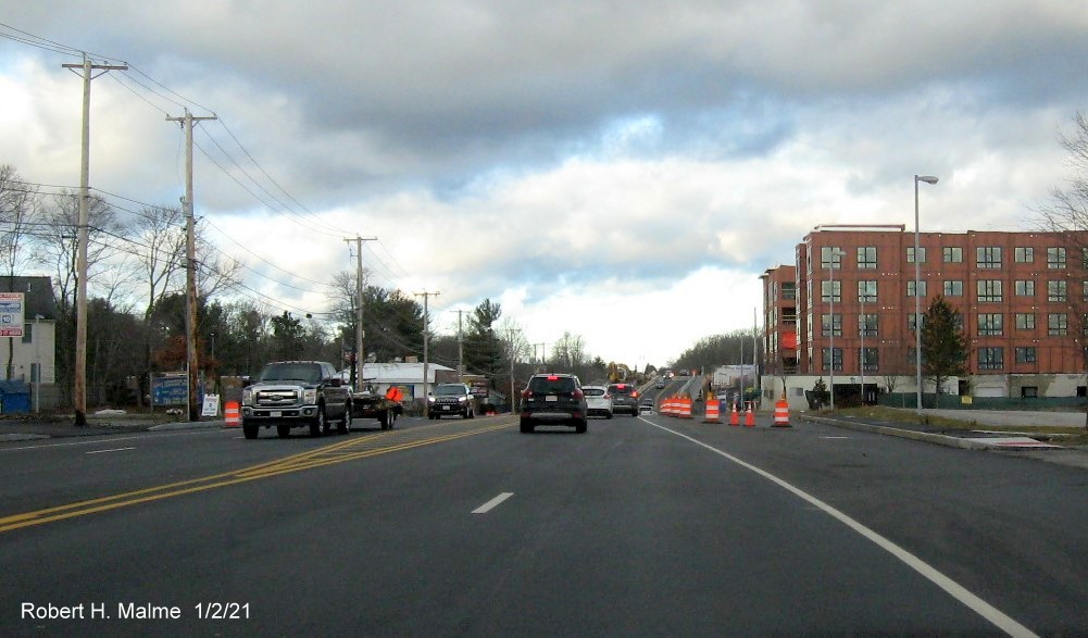 Image of widened 4-lane MA 18 northbound in South Weymouth approaching the lane closure at incomplete commuter
                                      railroad bridge, January 2021