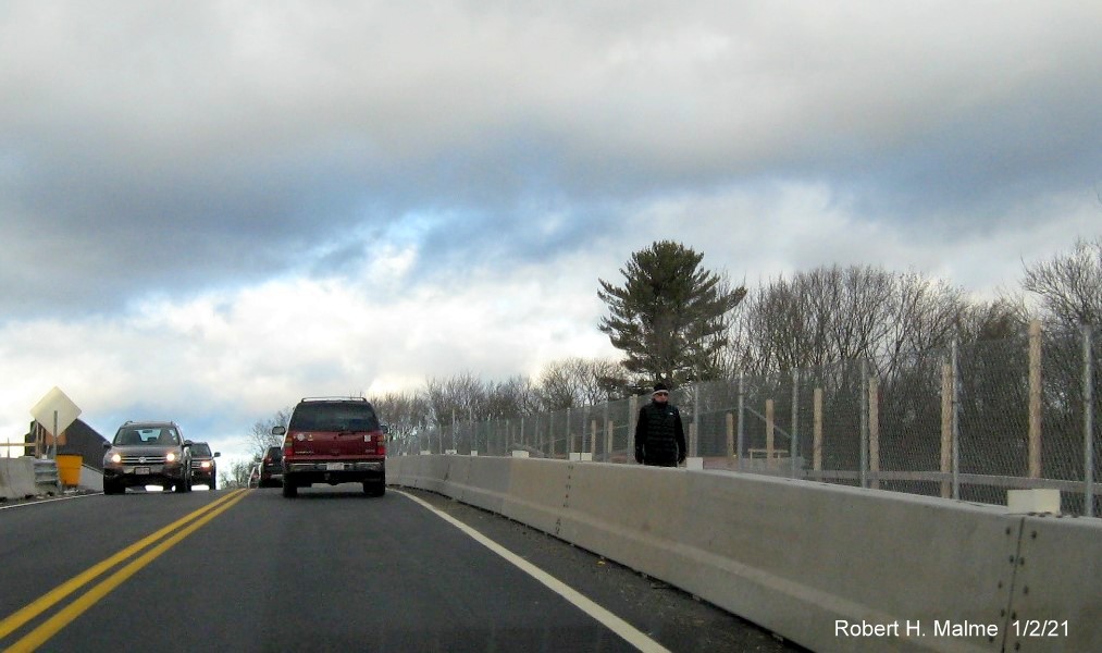 Image of new sidewalk intalled along MA 18 northbound in South Weymouth over the incomplete commuter
                                      railroad bridge, January 2021