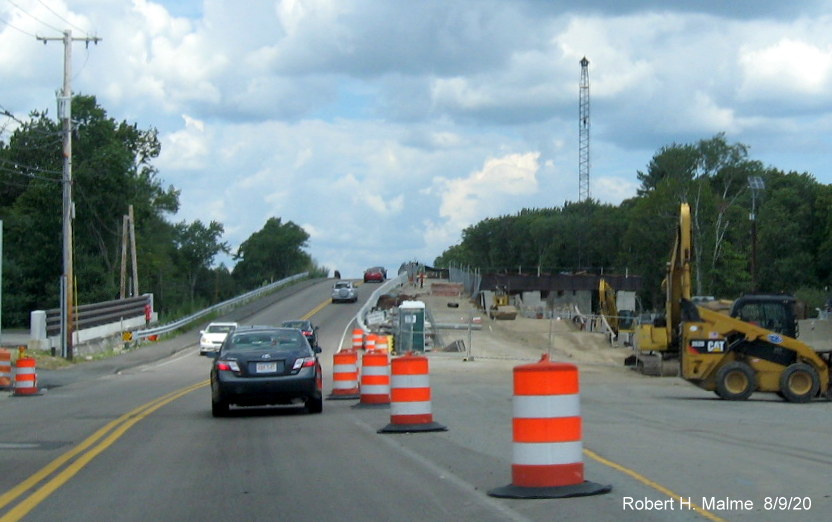 Image of new steel support beams in placed for new railroad bridge over commuter railroad tracks in widening project work zone in South Weymouth, August 2020