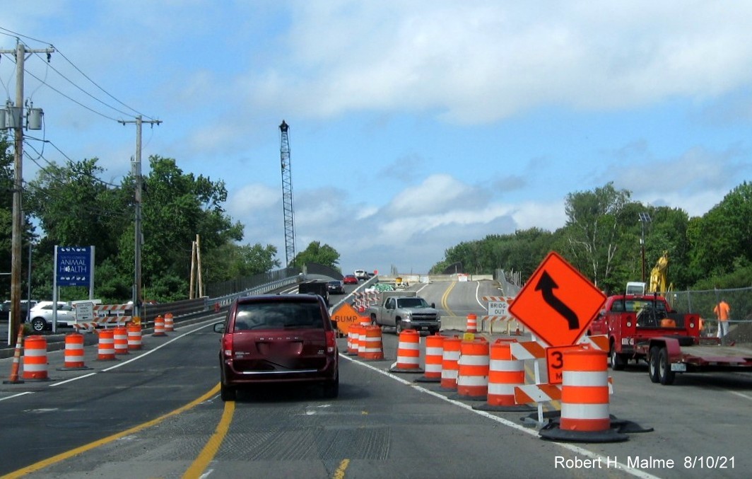 Image of traffic on MA 18 North approaching commuter railroad bridge still under construction in South Weymouth, August 2021
