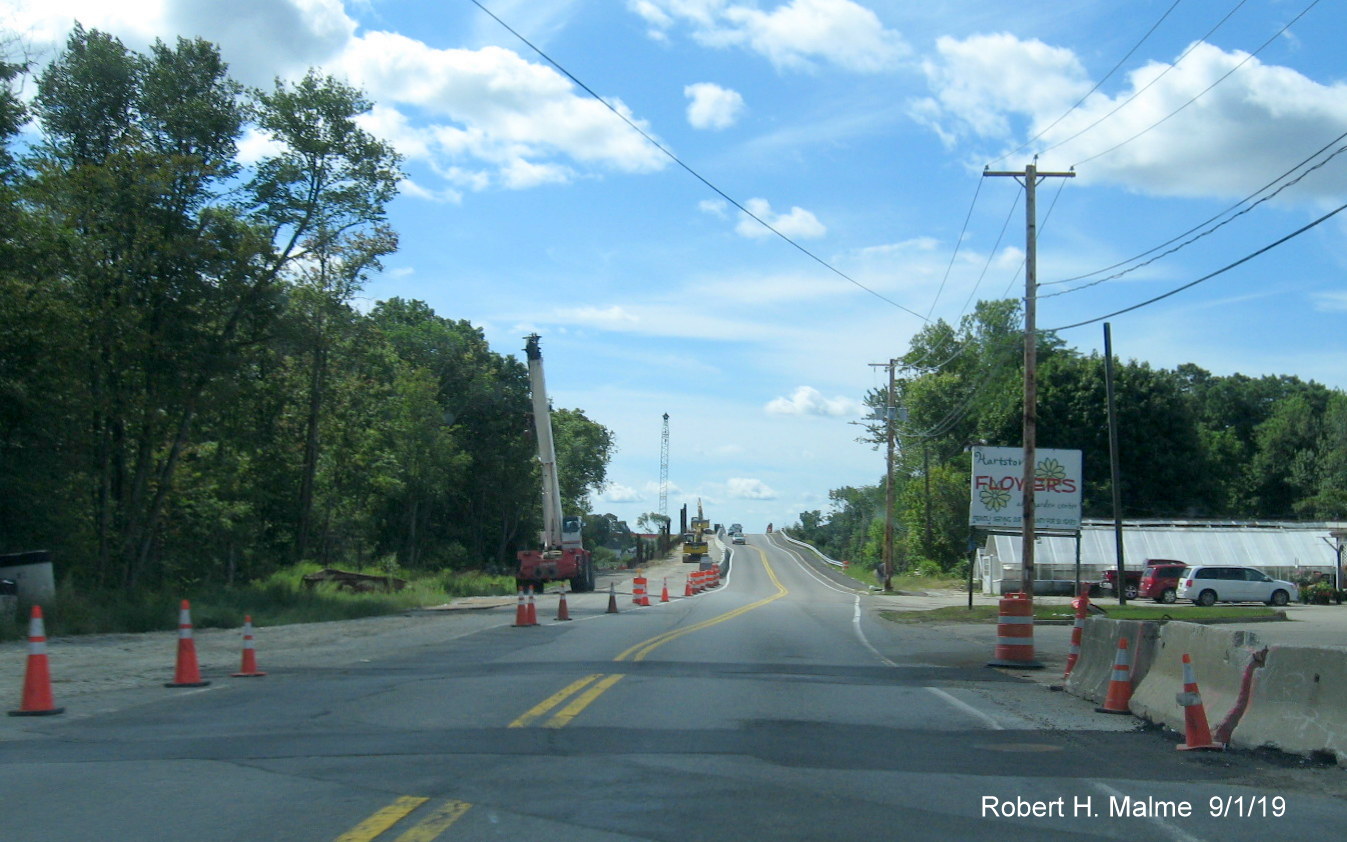 Image of construction along commuter rail bridge along MA 18 South as part of MassDOT widening project in South Weymouth