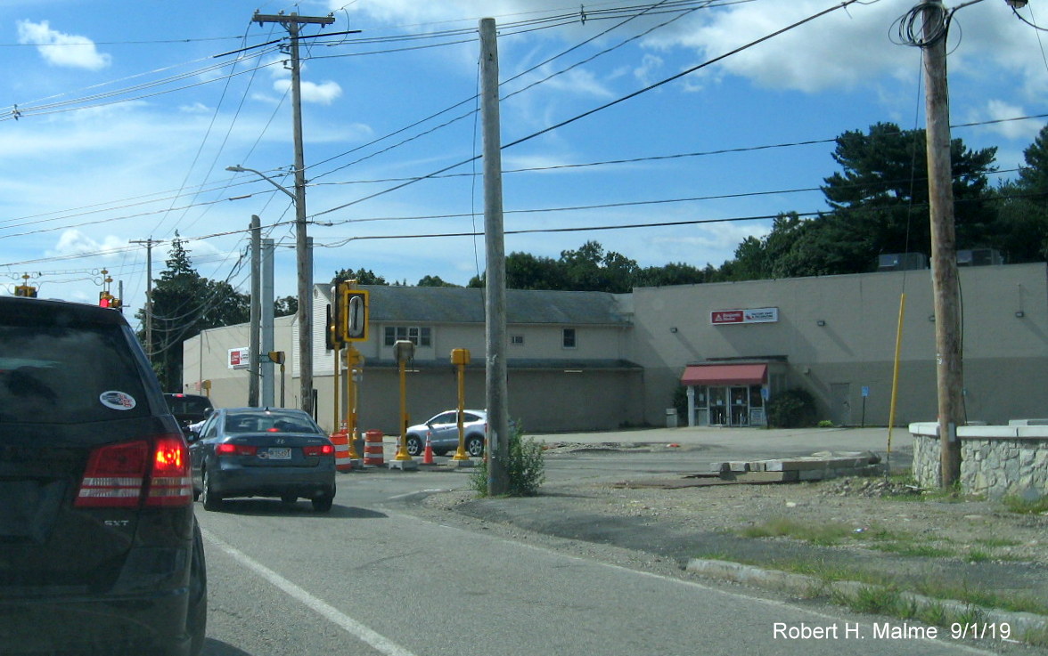 Image of closeup view of new traffic light being installed at intersection of MA 18 South and Pond Street as part of MassDOT widening project in South Weymouth