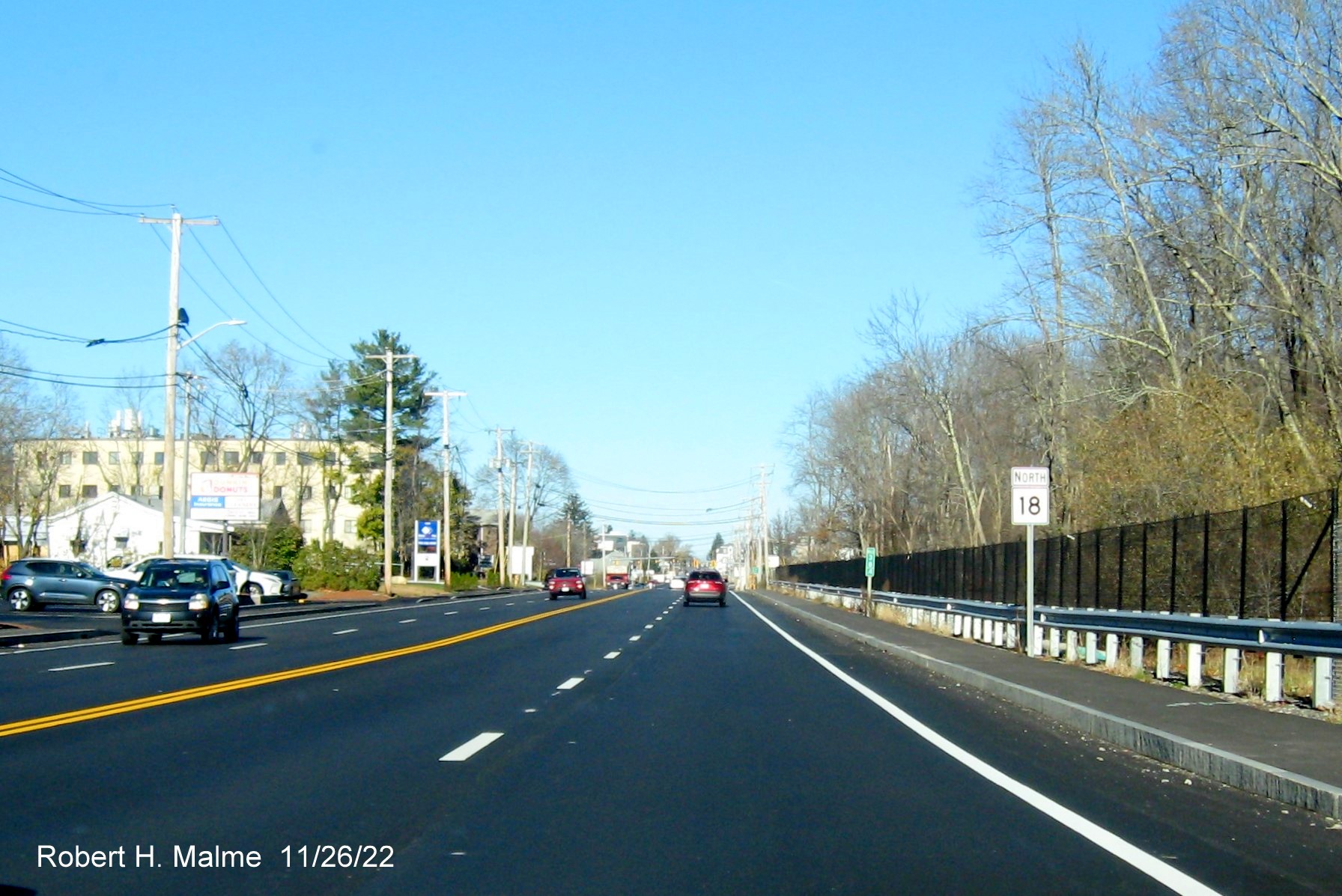 Image of North MA 18 reassurance marker after completed commuter railroad bridge in South Weymouth, November 2022