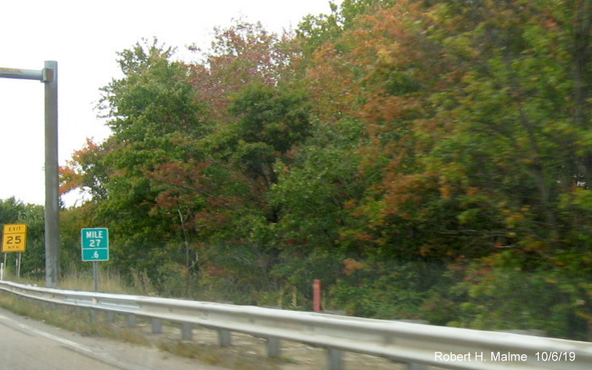 Image of foundation, behind guardrail, for future ramp sign for MA 106 East on MA 24 North in West Bridgewater