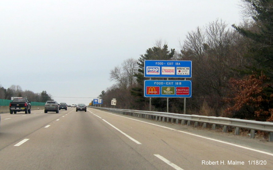 Image of blue services sign assembly with new panel on top on MA 24 North prior to MA 27 exit in Brockton