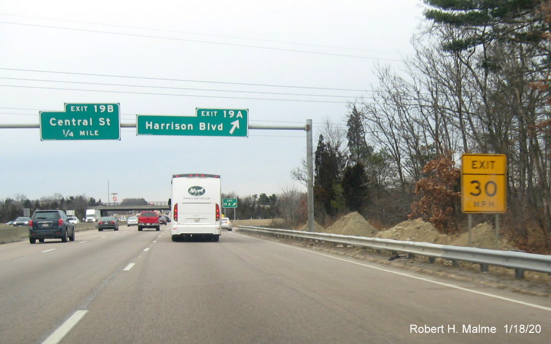 Image of excavated dirt piles for future overhead sign support on MA 24 North at ramp to Harrison Blvd in Avon