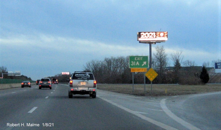 Image of gore sign for MA 123 East exit with new milepost based exit number 
                                      and yellow old exit number sign below on MA 24 South in Brockton, January 2021