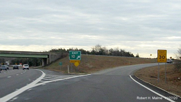 Image of gore sign at US 6 exit with new milepost based exit number and yellow old exit number tab below on MA 25 East in Bourne, November 2020
