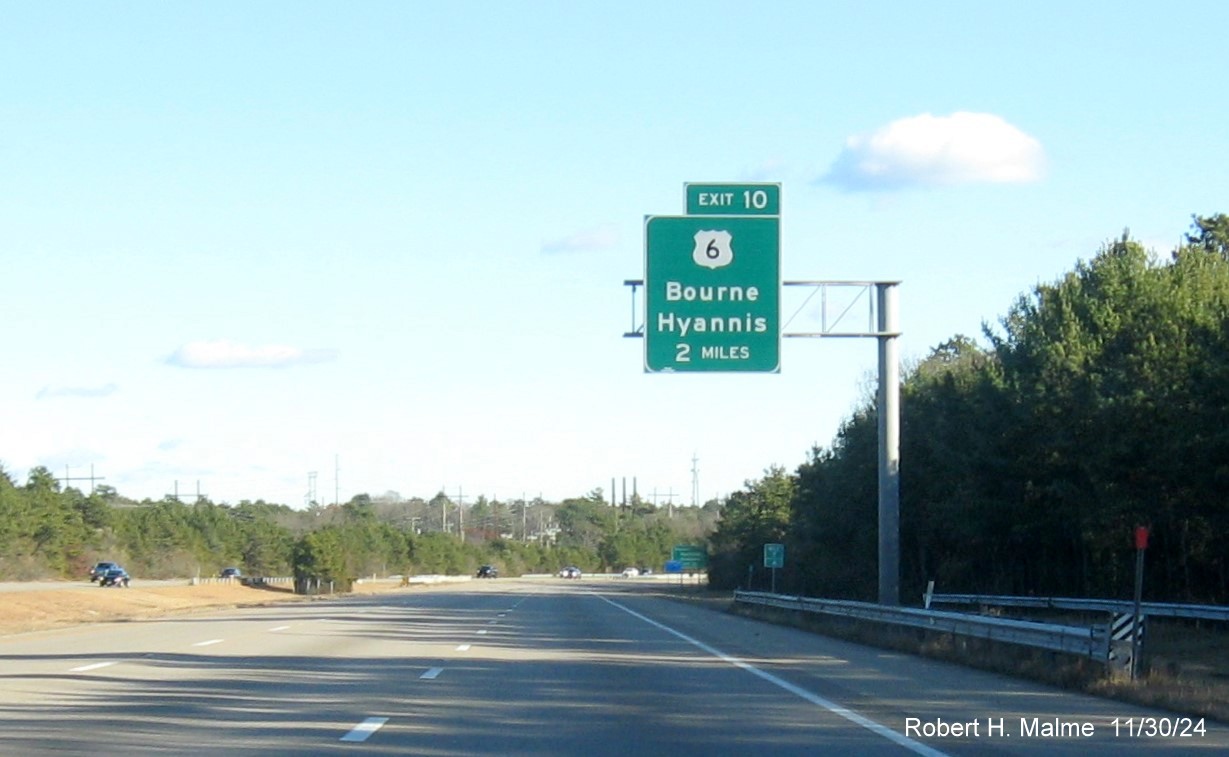 Image of recently placed 2 Miles advance overhead sign for US 6 Bourne exit on MA 25 East in Bourne, November 2024