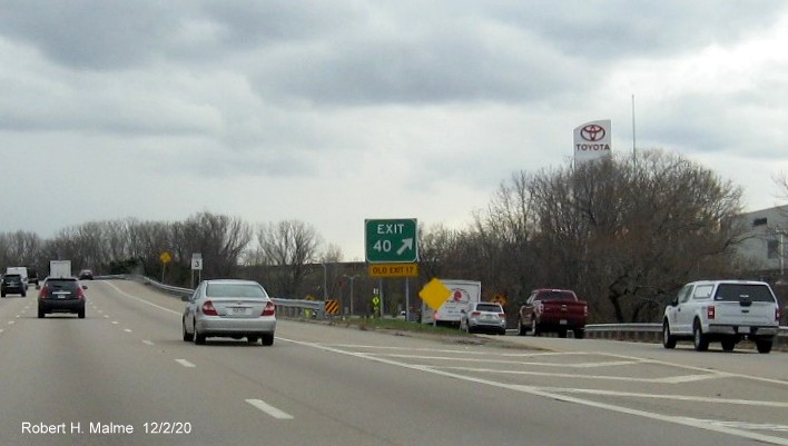 Image of gore sign for Union Street exit with new milepost exit number and yellow old exit number
                                     tab below on MA 3 South in Braintree, December 2020