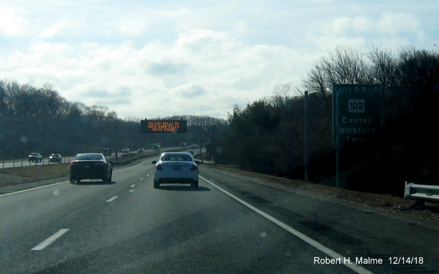 Image of new sign posts for RI 102 exit with new exit number on RI 4 South in East Greenwich