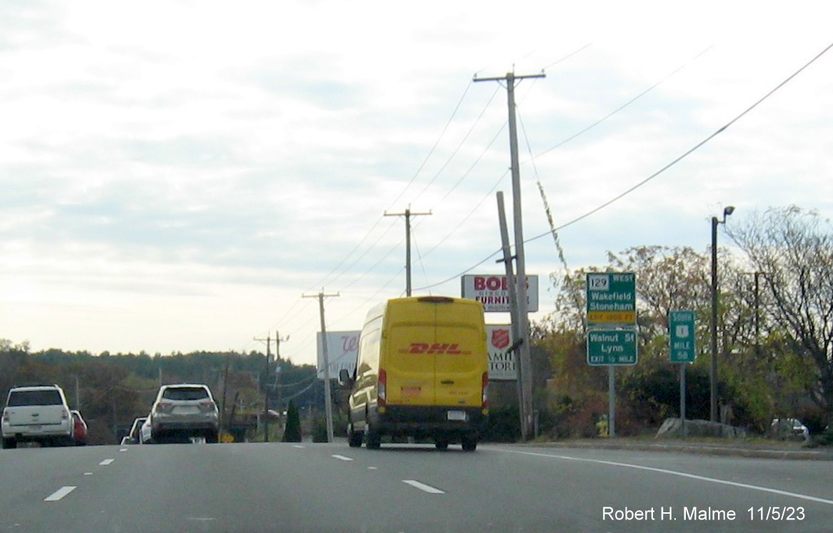 Image of recently placed ground mounted guide sign for MA 129 West exit on US 1 South in Lynnfield, November 2023