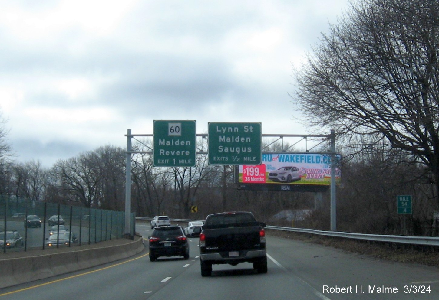 Image of recently placed overhead advance signs for MA 60 and Lynn Street exits on US 1 South in Malden, March 2024