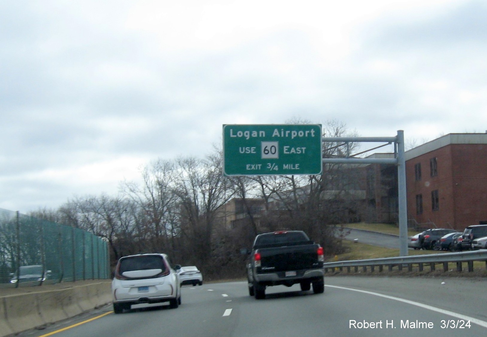 Image of recently placed overhead auxilary sign for the MA 60 exit on US 1 South in Malden, March 2024
