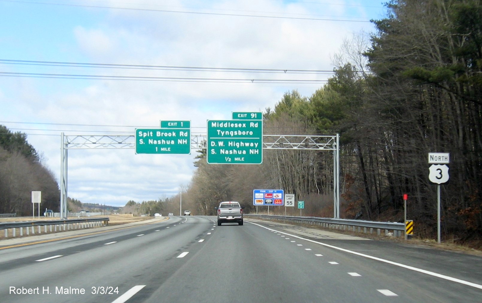 Image of recently placed 1/2 mile advance sign for the Middlesex Road/D.W. Highway exit on US 3 North 
      in Tyngsboro, March 2024