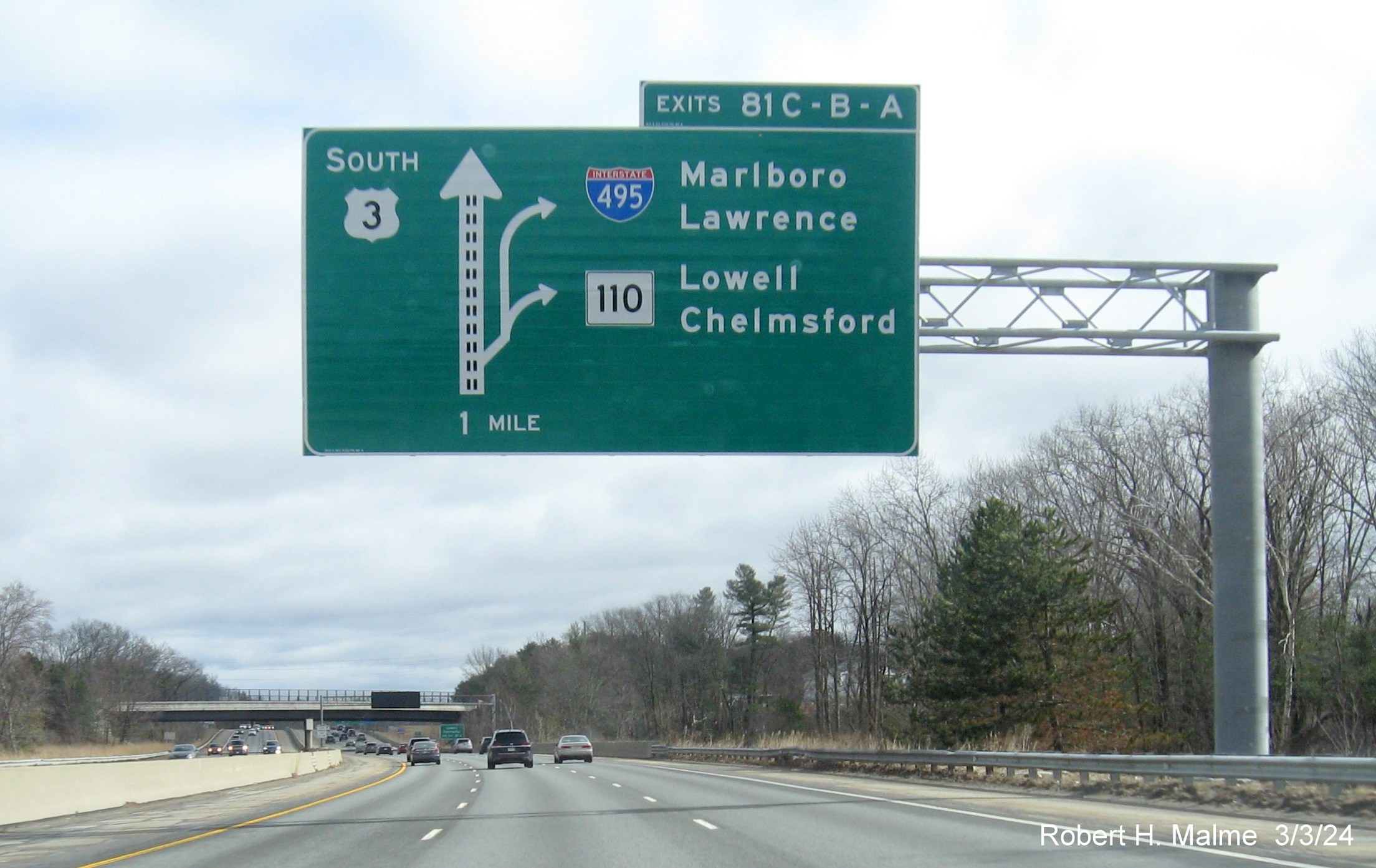 Image of newly placed 1 Mile advance overhead diagrammatic sign for I-495/MA 110 exits on US 3 South in Chelmsford, March 2024