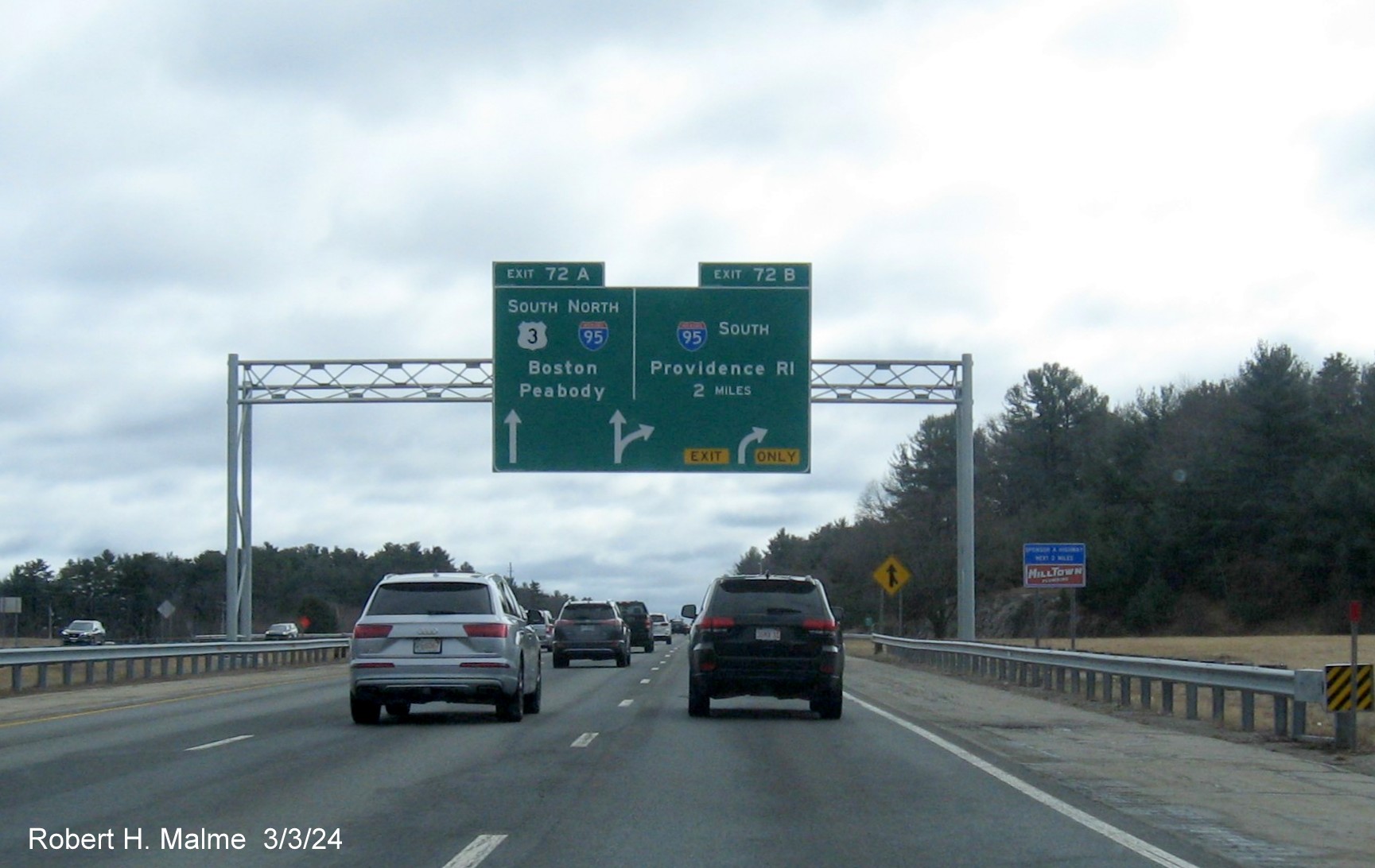 Image of newly placed 2 Miles advance overhead arrow-per-lane signs for I-95 exits on US 3 South in Burlington, March 2024