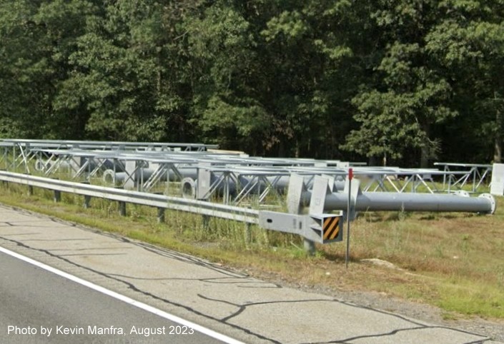 Image of sign poles and gantries awaiting installation along US 3 North near the Westford Road exit, by Kevin Manfra, September 2023