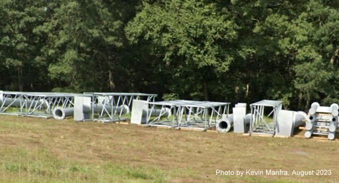 Image of sign poles and gantries awaiting installation along US 3 North near the Westford Road exit, by Kevin Manfra, September 2023