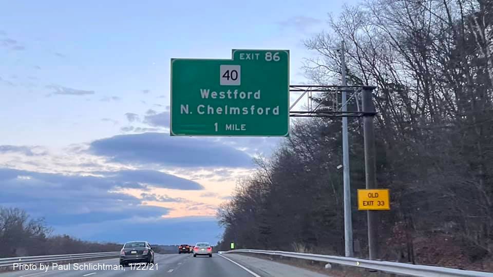 Image of 1-Mile advance overhead sign for MA 40 exit with new milepost based exit number and yellow old exit number sign on support post on US 3 South in Westford, by Paul Schlichtman, January 2021