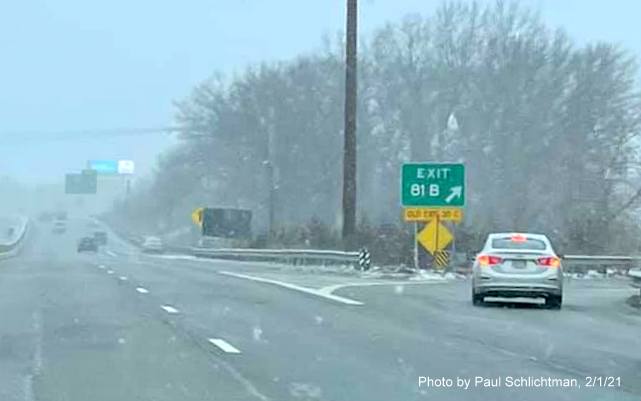 Image of gore sign for I-495 South exit with new milepost based exit number with yellow old exit number below on US 3 North in Chelmsford, by Paul Schlichtman. February 2021