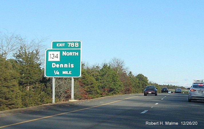 Image of 1/4 mile advance left side sign for MA 134 North exit with new milepost based exit number on US 6 East in Dennis, December 2020