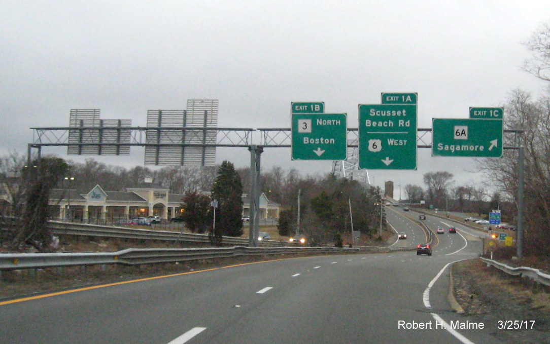 Image of overhead exit signs for MA 3, MA 6A and Scusset Rd on US 6 West in Bourne