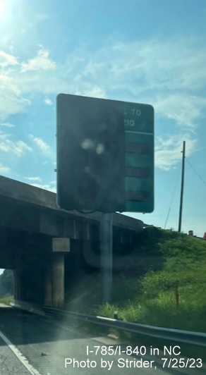 Image of newly placed and 1/2 covered digital travel time sign prior to the split of I-85 South 
          and I-40 West, photo by Strider, July 2023