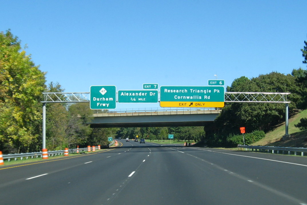 Image of overhead exits signs on the Durham Freeway North for Alexander Drive and Cornwallis 
Road, taken Oct. 2011