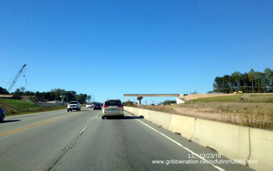 Image approaching new bridge being constructed over US 70 as part of East End Connector project in Durham, from LC