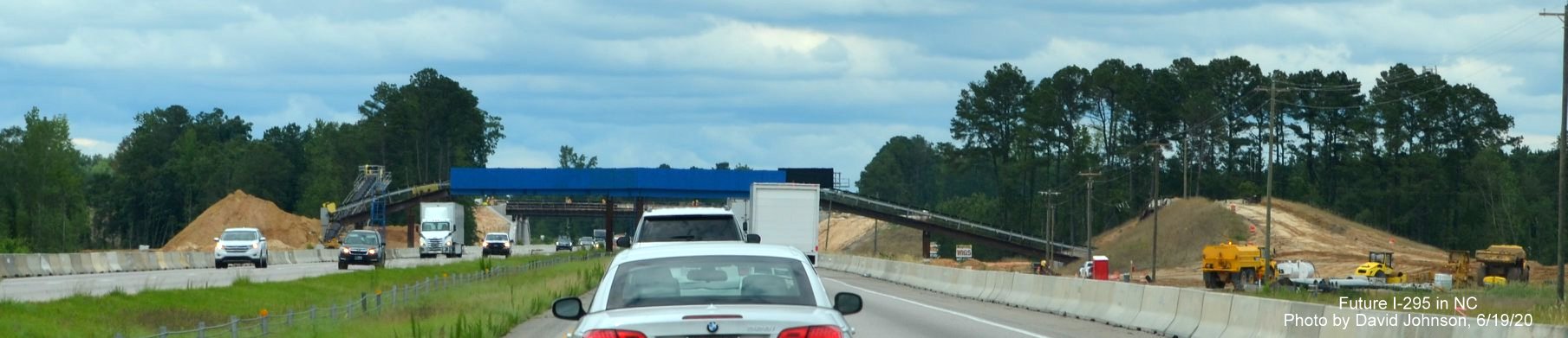Image of conveyor belt across I-95 for future I-295 interchange construction near Hope Mills, by David 
        Johnson June 2020