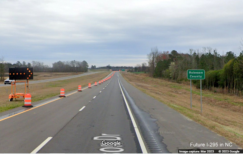 Image of Entering Robeson County guide sign along newly opened section of South 
        NC 295/Fayetteville Outer Loop from Black Bridge Road to Parkton Road, Google Maps Street View, March 2023