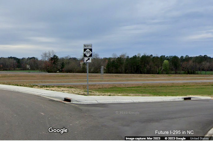 Image of North NC 295 trailblazer at northbound on-ramp from Parkton Road to 
        opened section of Fayetteville Outer Loop to Black Bridge Road, Google Maps Street View, March 2023