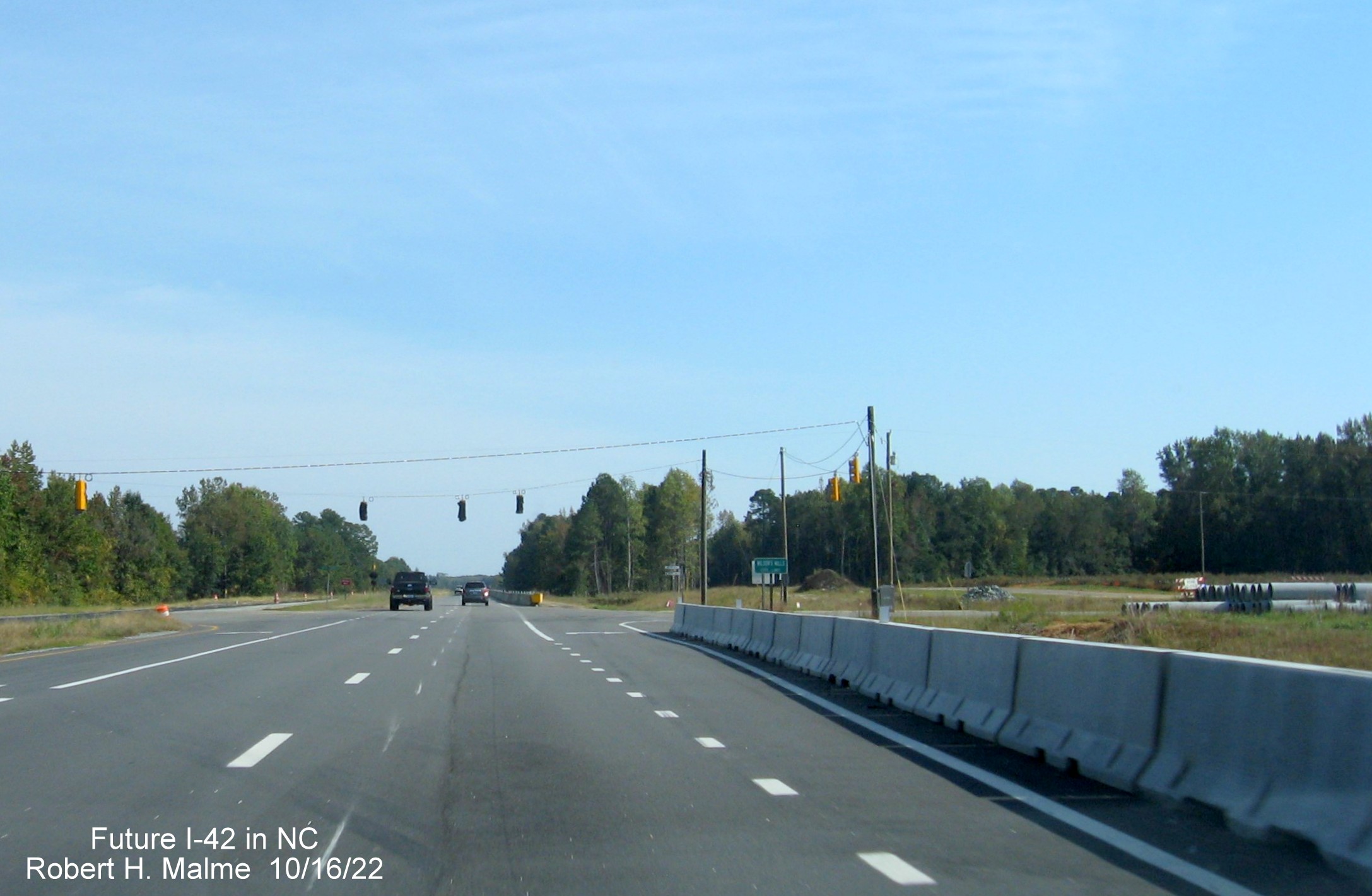 Image of current new traffic signals at Strickland Road intersection on US 70 East in Wilson Mills, October 2022